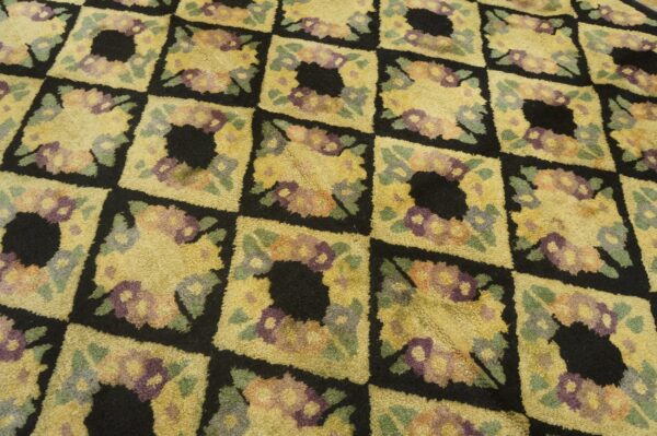 Close-up of a yellow and black floral checkered rug pattern by rugs on net
