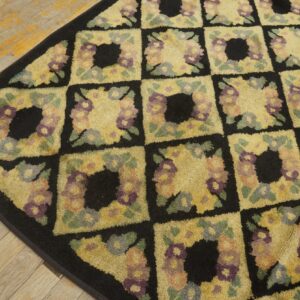 Close-up of a floral checkerboard rug pattern with black borders by Rugs On Net