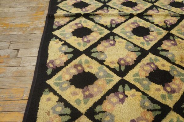 Close-up of a yellow and black floral diamond pattern rug by rugs on net