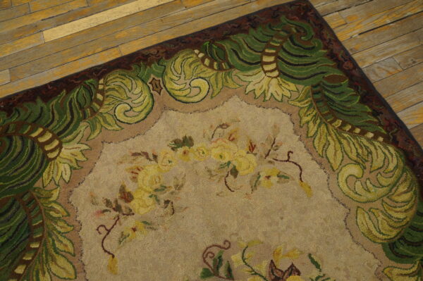Close-up of a floral rug with green vine border on wooden floor by rugs on net