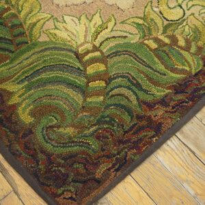 Close-up of the corner of a richly textured, earth-toned rug featuring swirling green and brown leaf patterns, by Rugs On Net. by Rugs On Net