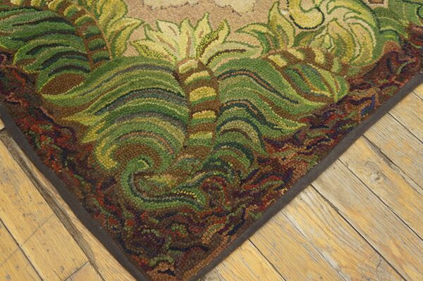 Close-up of the corner of a richly textured, earth-toned rug featuring swirling green and brown leaf patterns, by rugs on net. By rugs on net