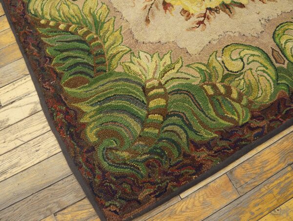 Close-up of a hooked rug border featuring lush green foliage patterns on a dark brown edge, by rugs on net