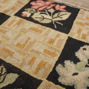 Close-up of a hooked rug with checkerboard pattern featuring stylized pink roses and geometric beige squares, by Rugs On Net