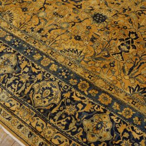 Close-up of a gold and navy floral patterned rug by Rugs On Net. by Rugs On Net