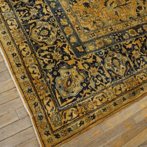 Close-up corner detail of a gold and navy blue traditional rug by Rugs On Net. by Rugs On Net