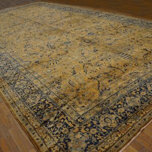 Large antique rug with gold and navy floral patterns by Rugs On Net. by Rugs On Net