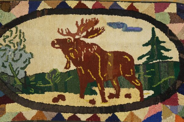 A hooked rug featuring a large brown moose in a woodland scene, by rugs on net. By rugs on net