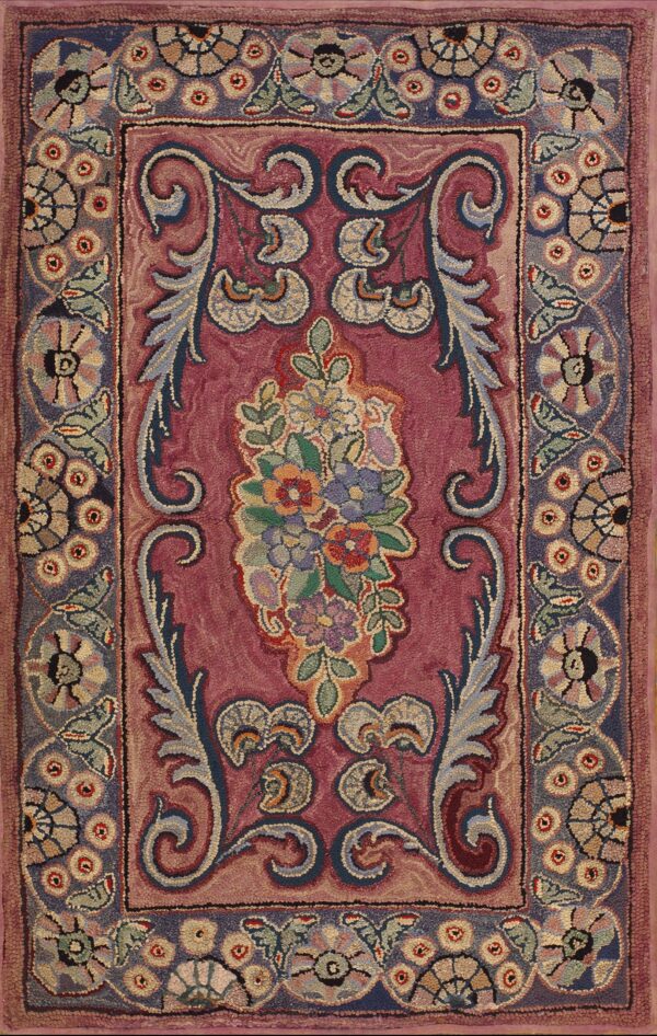 Coral salmon pink american hooked rectangle wool rug with stylized rosette border and deep magenta field rug by rugs on net