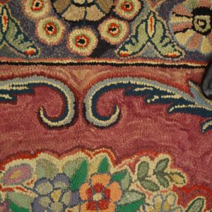 Close-up of a colorful floral hook rug pattern by Rugs On Net