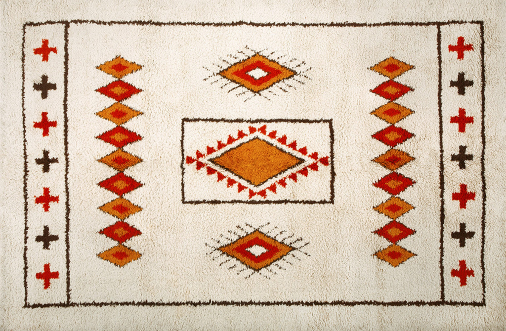 Cream shag rug featuring orange, red, and brown tribal diamond and cross patterns by rugs on net