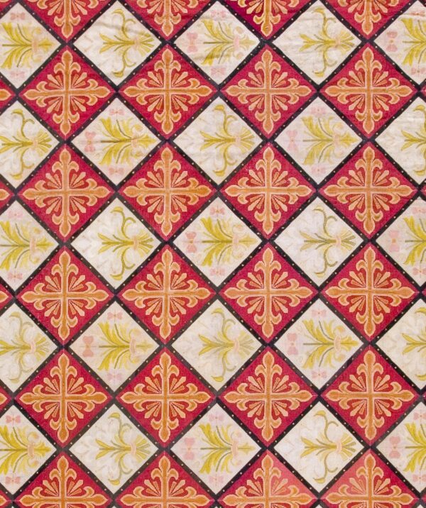 Close-up of a diamond pattern rug featuring alternating red and white squares with ornate floral designs, by rugs on net