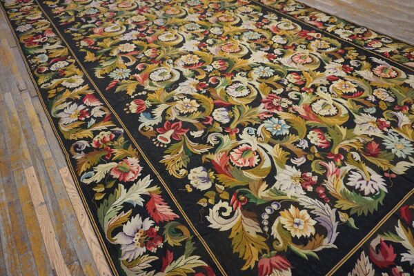Close-up of a dark aubusson rug with vibrant floral and foliage patterns, by rugs on net