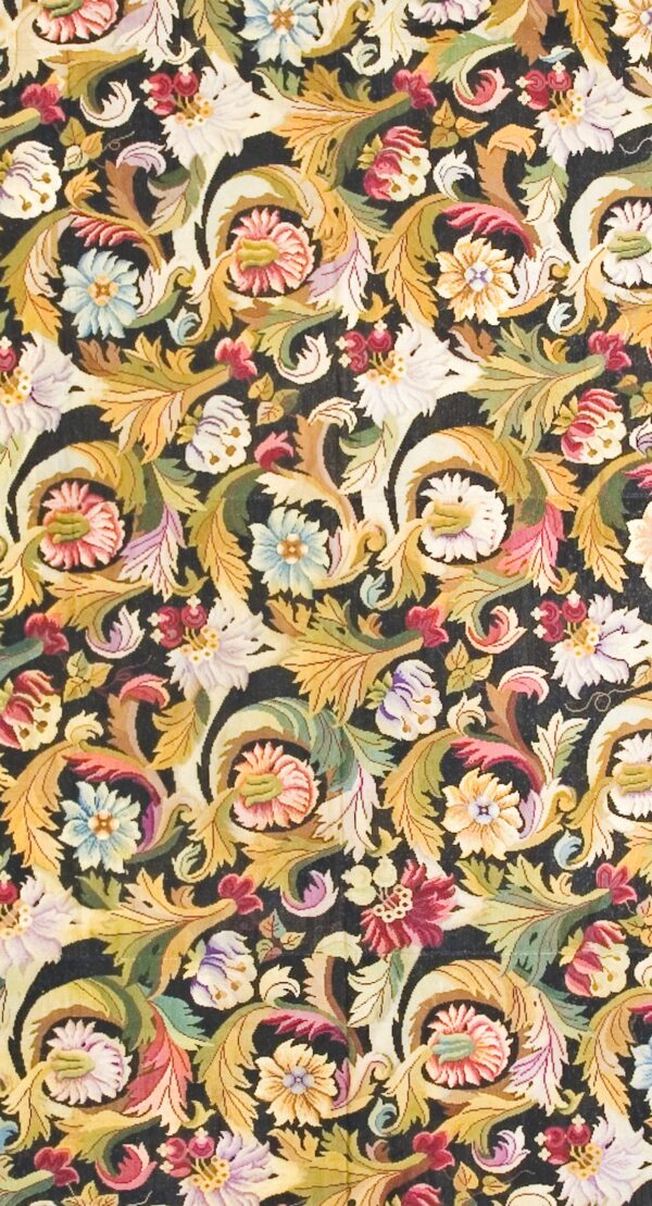 Close-up of a dark tapestry featuring dense floral and acanthus scrollwork in gold, pink, blue, and green hues, by rugs on net