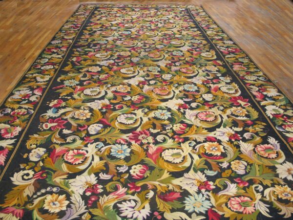 Long, dark aubusson runner rug with vibrant floral scrollwork, by rugs on net