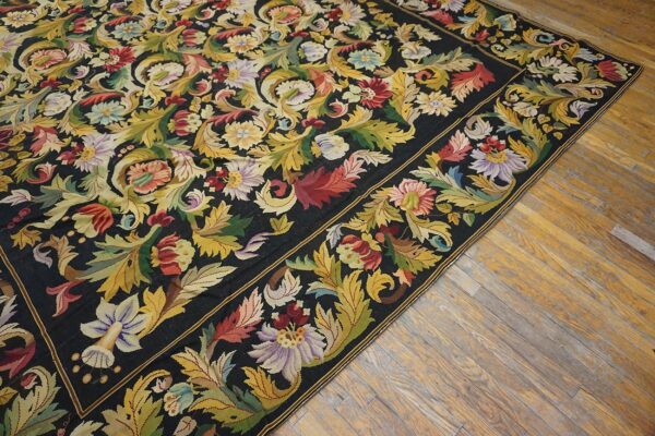 Close-up of a dark, floral tapestry rug with vibrant colors, by rugs on net