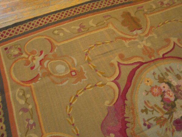 Close-up of a traditional tapestry rug with beige field and floral accents by rugs on net