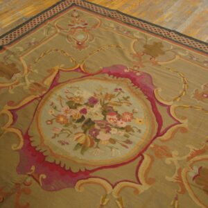 Close-up of a tapestry rug featuring a central floral medallion on a tan ground, by Rugs On Net. by Rugs On Net