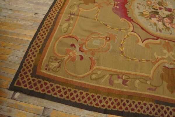 Close-up of a tapestry rug with floral motifs on a tan field, showing the border detail by rugs on net. By rugs on net