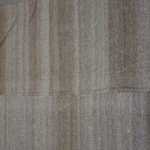 Close-up texture of a neutral beige flatweave rug with vertical striping, showing hand-stitched details against a weathered wood floor, by Rugs On Net