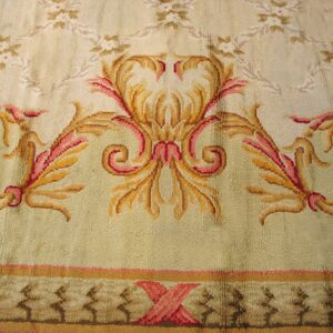 Close-up of a cream and gold Aubusson rug detail with pink accents by Rugs On Net