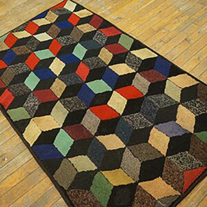 A colorful, geometric rug featuring a 3D cube pattern on a wooden floor by Rugs On Net. by Rugs On Net