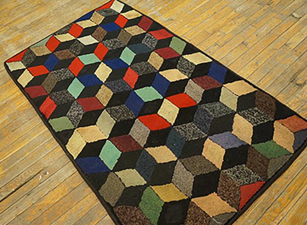 A colorful, geometric rug featuring a 3d cube pattern on a wooden floor by rugs on net. By rugs on net