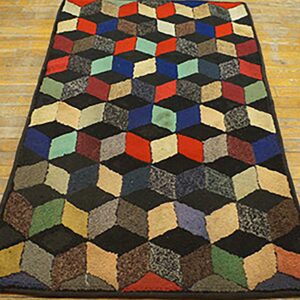A colorful hooked rug featuring a 3D cube illusion pattern, by Rugs On Net