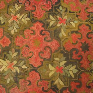Close-up of a hooked rug featuring red paisley-like motifs against an olive and dark brown background by Rugs On Net. by Rugs On Net