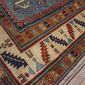Close-up view of the border pattern on the Caucasian rug by Rugs On Net