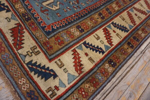 Close-up view of the border pattern on the caucasian rug by rugs on net