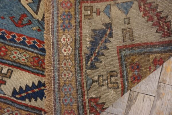 Close-up of the woven texture and geometric patterns of the tribal kilim rug by rugs on net. By rugs on net