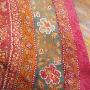 Close-up of a vibrant pink and orange patterned rug detail by Rugs On Net