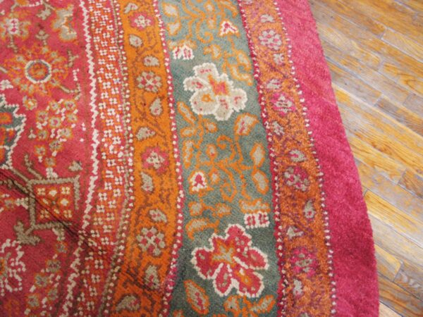 Close-up of a vibrant pink and orange patterned rug detail by rugs on net