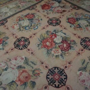 Close-up of a pink Aubusson-style rug with large floral bouquets and medallions by Rugs On Net
