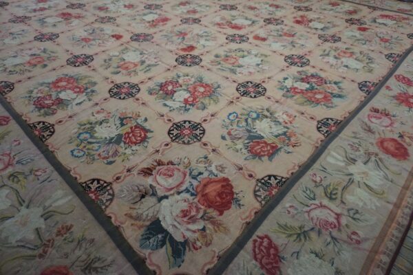 Close-up view of a floral tapestry rug with a lattice design by rugs on net. By rugs on net