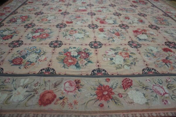 Close-up of a floral tapestry rug with pink and cream tones by rugs on net. By rugs on net