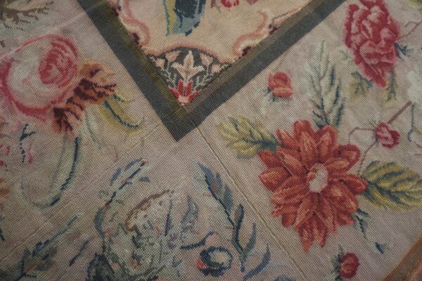 Close-up of a floral needlepoint rug pattern featuring red and pink roses by rugs on net. By rugs on net
