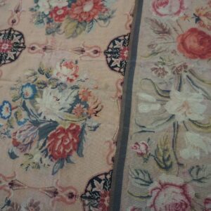 Close-up of a vintage floral tapestry rug with pink background by Rugs On Net