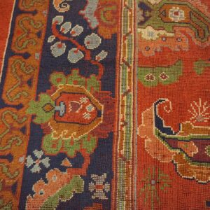 Close-up of vibrant geometric patterns and rich colors on the rug by Rugs On Net