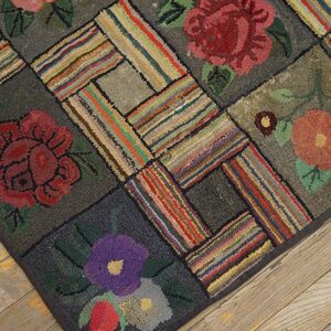 Close-up of a hooked rug with floral squares and striped patchwork by Rugs On Net. by Rugs On Net
