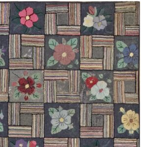 Close-up of a colorful hooked rug featuring a patchwork design with floral squares and striped rectangles, by Rugs On Net. by Rugs On Net