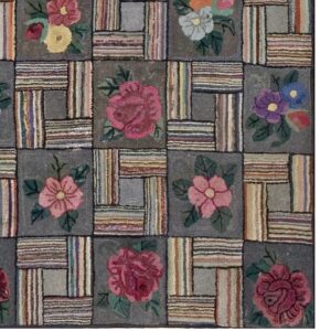 Close-up of a hooked rug featuring a patchwork design with floral squares and striped blocks, by Rugs On Net