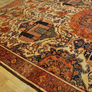 Close-up of an antique rug with geometric and floral motifs in red, blue, and cream, by Rugs On Net