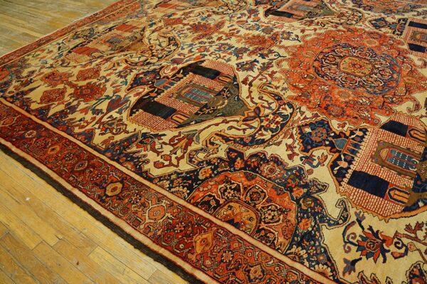 Close-up of an antique rug with geometric and floral motifs in red, blue, and cream, by rugs on net
