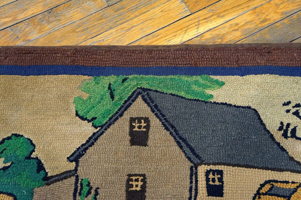 Close-up of a hooked rug depicting a house and trees, by rugs on net. By rugs on net