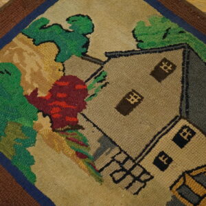 Close-up of a hooked rug featuring a stylized house and landscape in earthy tones, by Rugs On Net. by Rugs On Net