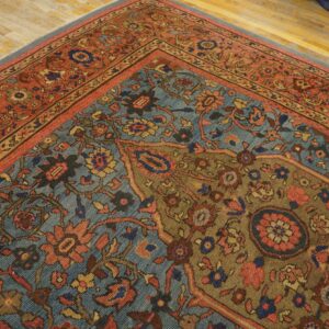 Close-up of a richly patterned antique rug with blue, red, and brown tones by Rugs On Net