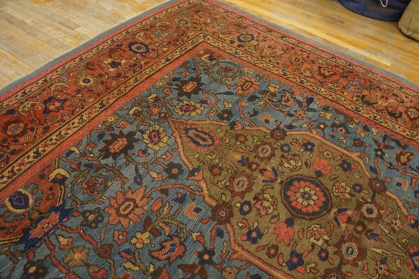 Close-up of a richly patterned antique rug with blue, red, and brown tones by rugs on net