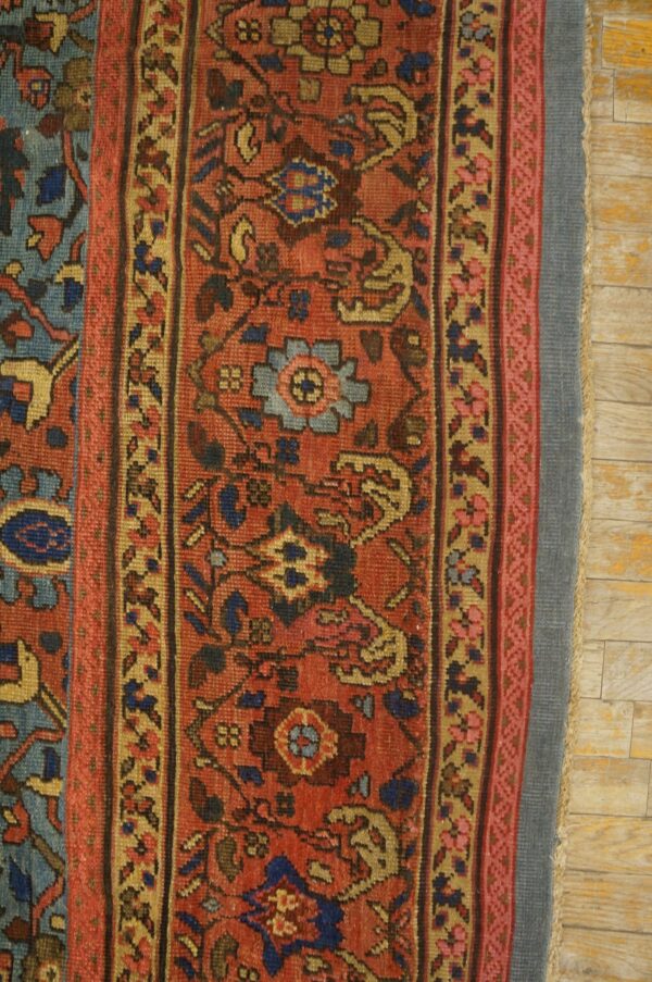 Close-up of a richly colored oriental rug border featuring red, blue, and gold geometric patterns by rugs on net